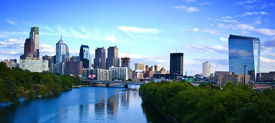 the Schuylkill River running through Philadelphia, with tall buildings in the background